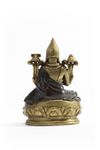 A Mongolian parcel-gilt bronze figure of a Lama