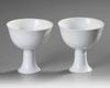 A PAIR OF CHINESE WHITE-GLAZED DRAGONS STEM CUPS, 20TH CENTURY