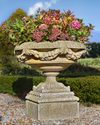 A CARVED LIMESTONE GARDEN URN, LATE 20TH CENTURY