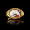 A ROMAN RING WITH A CAMEO OF A DOG, 1ST CENTURY AD