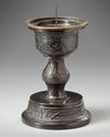 A Chinese bronze candle holder