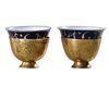 TWO OTTOMAN GILDED TOMBAK ZARF HOLDERS, WITH ORIGINAL PORCELAIN ZARFS, 18TH CENTURY