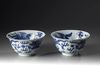 A pair of blue and white 'dragon and phoenix' bowls