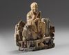 A Chinese soapstone figure of a seated Luohan