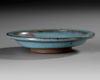 A CHINESE JUNYAO PURPLE-SPLASHED SAUCER DISH, YUAN DYNASTY (1279-1368)