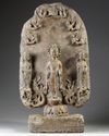 A large Chinese stone stele Buddhist triad