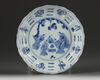 A Chinese blue and white 'Eight Daoist Emblems' barbed rim dish