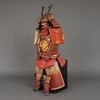 A RED LACQUER JAPANESE SUIT-OF-ARMOUR BY SATSUMA KUNIZUMI, 11TH GENERATION MITSUNOBU, MID 20TH CENTURY