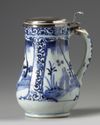 A JAPANESE BLUE AND WHITE JUG WITH SILVER COVER, 17TH CENTURY