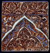 AN ILKHANID COBALT-BLUE, TURQUOISE AND LUSTRE MOULDED POTTERY TILE, IRAN, LATE 13TH-EARLY 14TH CENTURY