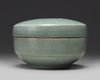 A KOREAN CELADON-GLAZED 'PEONIES' ROUND BOX AND COVER