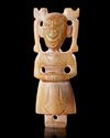 A CHINESE JADE FEMALE FIGURE,  SHANG DYNASTY (c. 1600–1046 BCE)