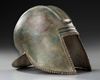 A GREEK BRONZE ILLYRIAN HELMET, CIRCA 6TH-5TH CENTURY B.C.