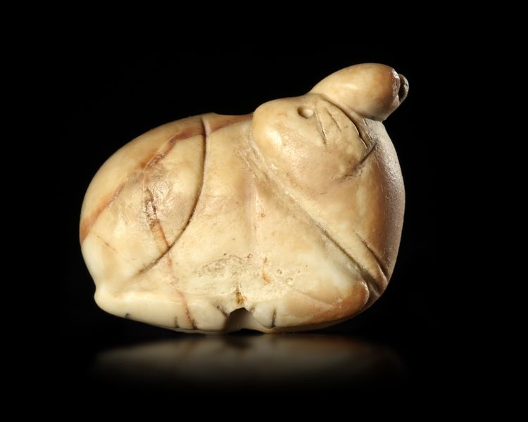 A JEMDET NASR SEAL IN THE FORM OF A RECLINING RABBIT, 3RD MILLENIUM BC