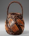 A JAPANESE BAMBOO IKEBANA BASKET, TAISHO PERIOD (1912-1926)