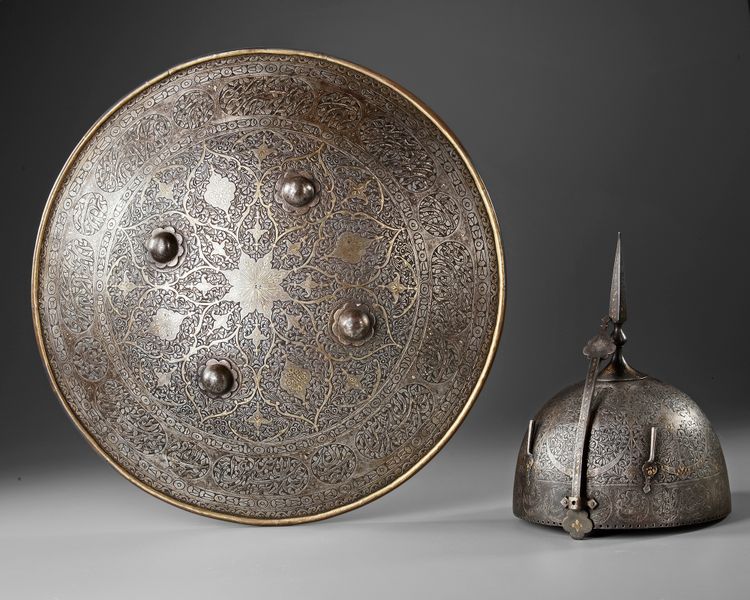 GILT QAJAR WATERED-STEEL HELMET AND SHIELD, PERSIA, 19TH CENTURY
