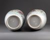 A pair of Chinese famille rose twin gilt-handled baluster vases