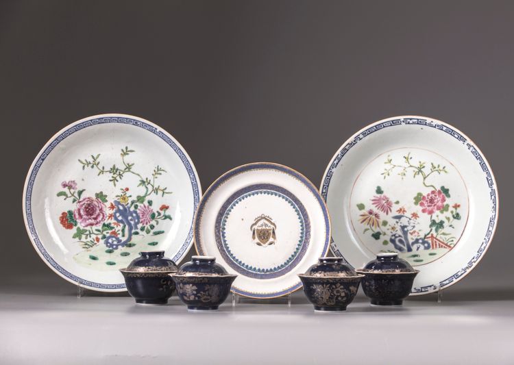 Three Chinese plates and four sets of blue-ground famille rose cups and saucers