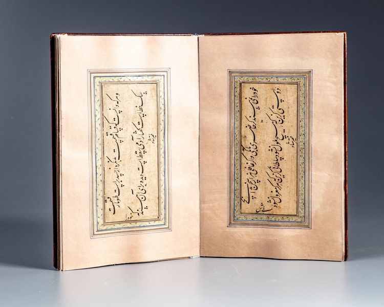 A PERSIAN CONCERTINA-STYLE ALBUM OF NASTA'LIQ CALLIGRAPHY, SIGNED 'FAKIR SHAD', IN FARSI, ILLUMINATED MANUSCRIPT ON PAPER, QAJAR PERSIA, DATED JUMADA AL-THANI 1337 AH/1919 AD