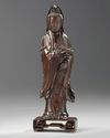 A Chinese hongmu carving of Guanyin and stand