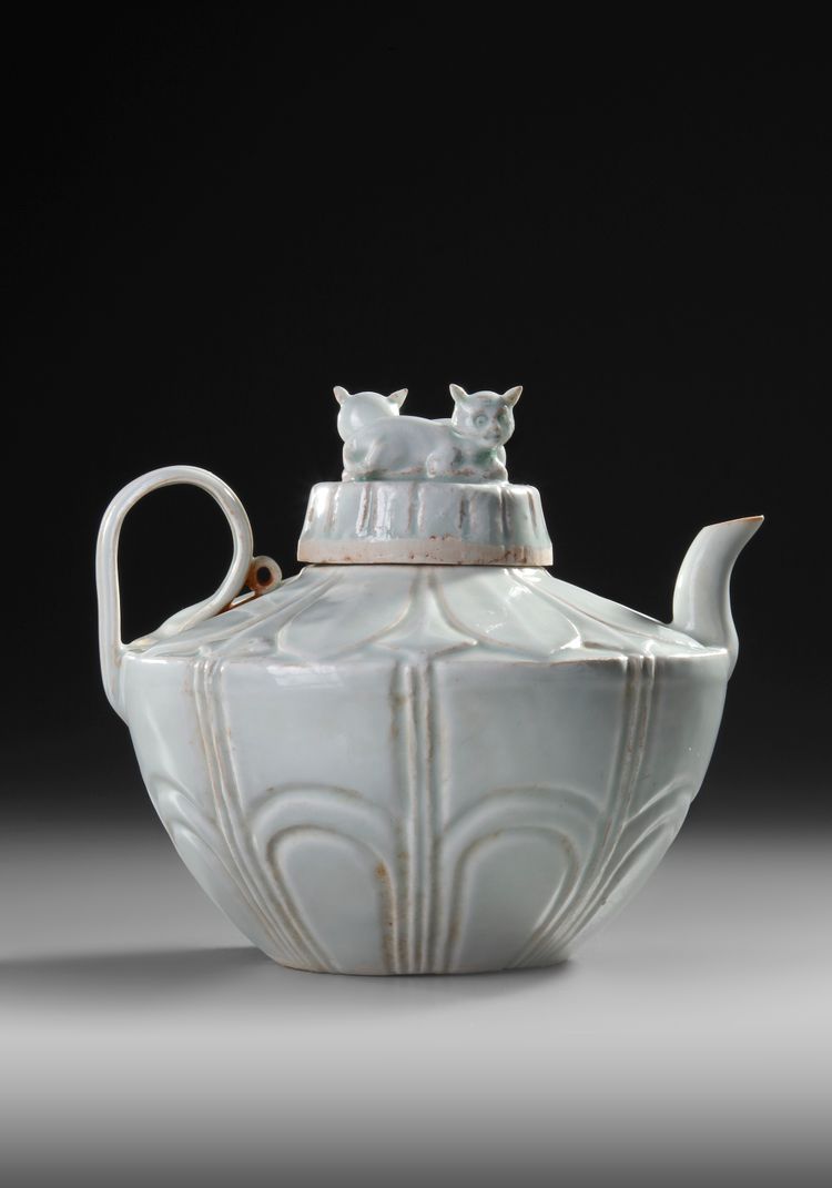 A CHINESE QINGBAI RECUMBENT CATS EWER AND COVER, NORTHERN SONG DYNASTY (960–1127)