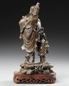 A CHINESE BRONZE FIGURE  OF LOHAN WITH A BOY, 19TH CENTURY