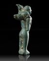 A WESTERN ASIATIC BRONZE STATUETTE OF MAN CARRYING AN ANIMAL, CIRCA 3RD MILLENNIUM B.C.