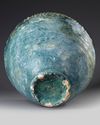 A LARGE POST SASSANIAN TURQUOISE GLAZED POTTERY STORAGE JAR,  PERSIA OR IRAQ, 7TH-8TH CENTURY