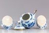 A Chinese blue and white teapot and two oval shaped trays