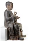 A CHINESE POLYCHROME-DECORATED WOOD LUOHAN, LATE MING DYNASTY, 17TH CENTURY