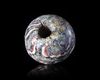 A LARGE SPHERICAL MOSAIC GLASS BEAD, ROMAN 1ST CENTURY AD