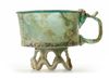 AN APPLIED GLASS FOOTED CUP, PERSIA, 9TH CENTURY