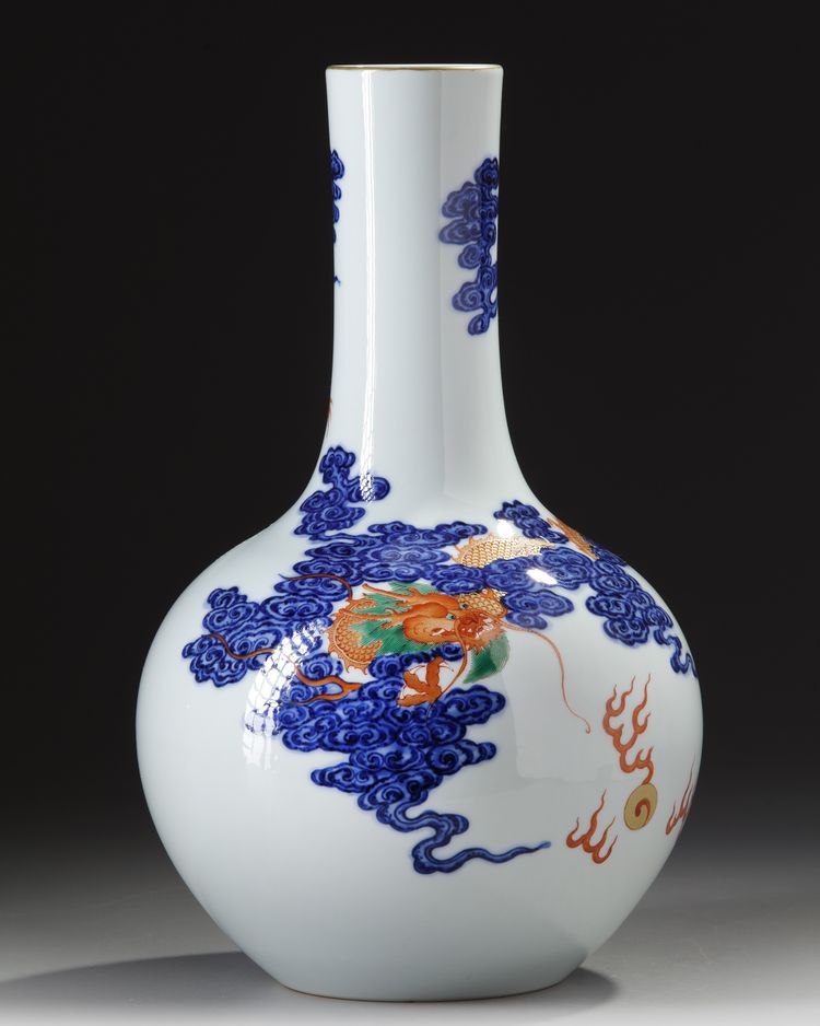 A CHINESE BLUE AND WHITE IRON-RED DECORATED 'DRAGON' BOTTLE VASE