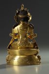 A Sino-Tibetan gilt bronze figure of Vajradhara