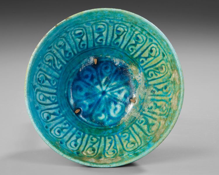 BAMIYAN MONOCHROME MOULDED POTTERY BOWL, PERSIA, 12TH- 13TH CENTURY