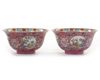 A PAIR OF SGRAFFITO RUBY-GROUND FAMILLE ROSE 'MEDALLION' BOWLS