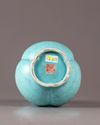 A Chinese celadon-ground white-enamel-decorated conjoined triple-neck double-gourd vase