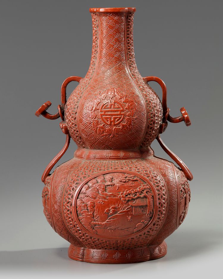 A Chinese imitation-cinnabar-lacquer double gourd vase