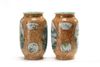 A pair of Chinese imitation puddingstone-ground famille rose vases