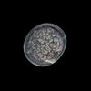 AN EARLY ISLAMIC GLASS WEIGHT OF HALF QUARTER DIRHAM