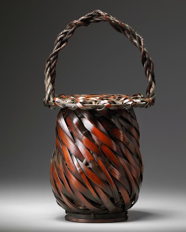 A Japanese round wickerwork ikebana flower basket