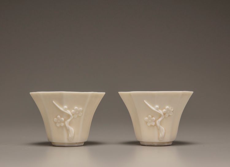 A pair of white-glazed octagonal 'prunus' cups