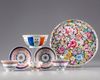 A Chinese famille rose group of three cups, two saucers, a bowl and a dish