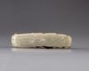 A pale celadon jade carving of a dragon and a chilong