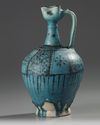 A LARGE RAQQA UNDERGLAZE PAINTED POTTERY EWER, SYRIA, 12TH-13TH CENTURY