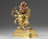 A Tibetan gilt bronze six-armed Mahakala