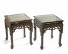 A pair of Chinese hongmu stools inset with a Cantonese famille rose panel