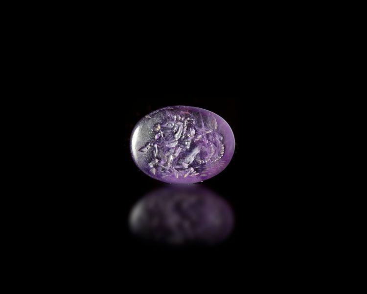 A ROMAN AMETHYST INTAGLIO OF EROS ON A SEA HORSE, 1ST- 2ND CENTURY AD