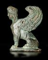 A SEATED BRONZE SPHINX, HELLENISTIC, 1ST-2ND CENTURY BC
