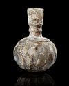 A WHEEL-WHEEL-CUT CLEAR GLASS BOTTLE NORTH EAST PERSIA, 9TH-10TH CENTURY